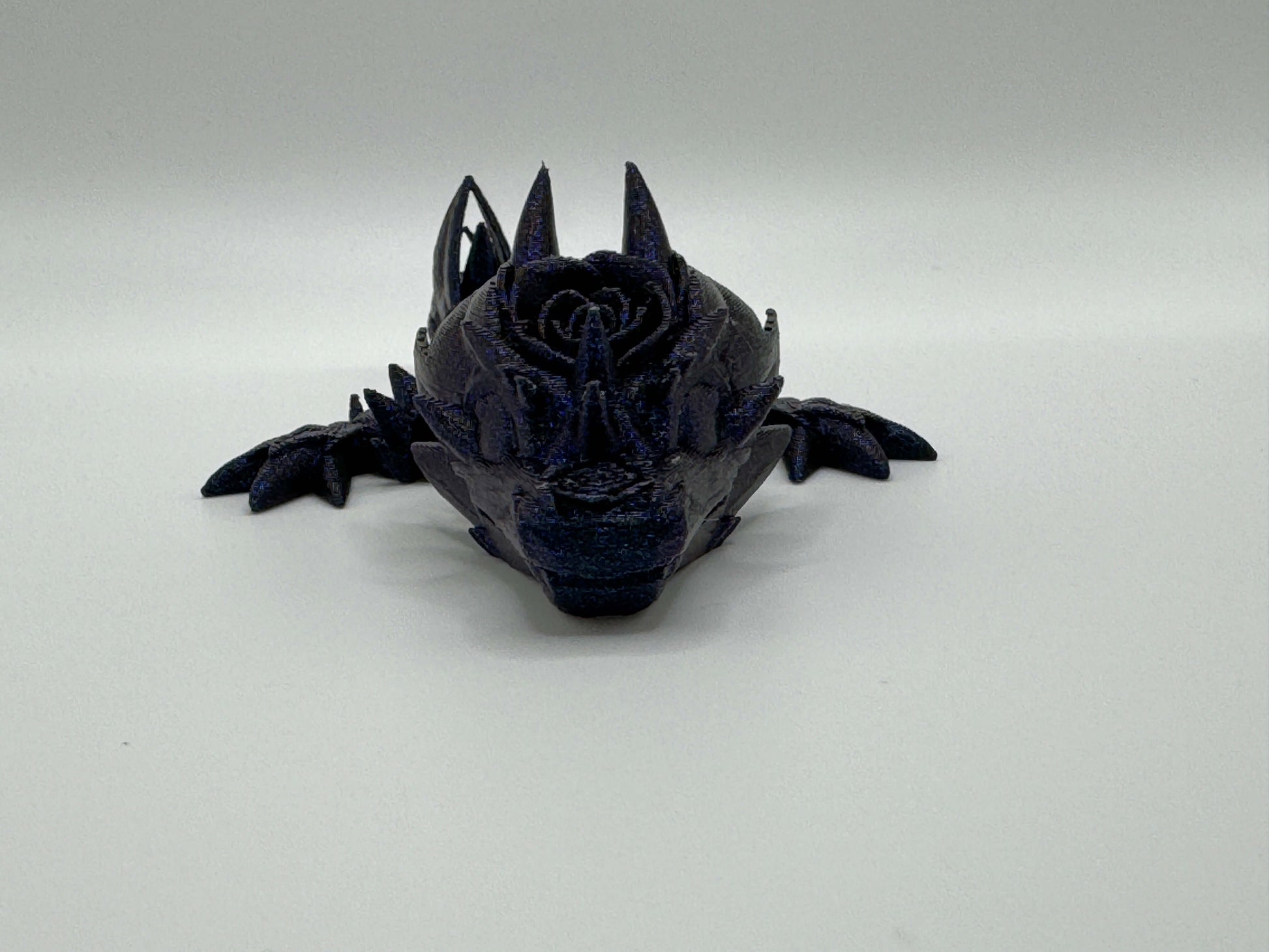 Rose Tadling tiny dragon single colour front close-up burned titanium