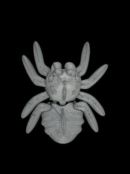 tiny small 3d-printed spider with articulated legs and body. Designed by Cinderwing3D, printed by 3d marvels in ireland