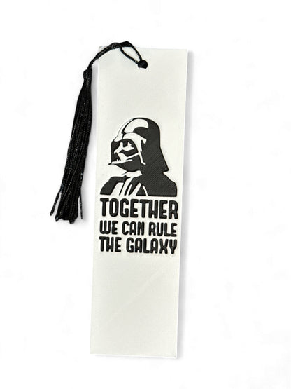 Fan created bookmark inspired by the Star Wars universe.
Top reads: "Together We Can Rule The Galaxy"
Darth Vader depicted on top of the quote


3D Printed and coloured by 3D Marvels, designed by Mysstra hueforge 3Dart

*Ribbon colour is random for each item