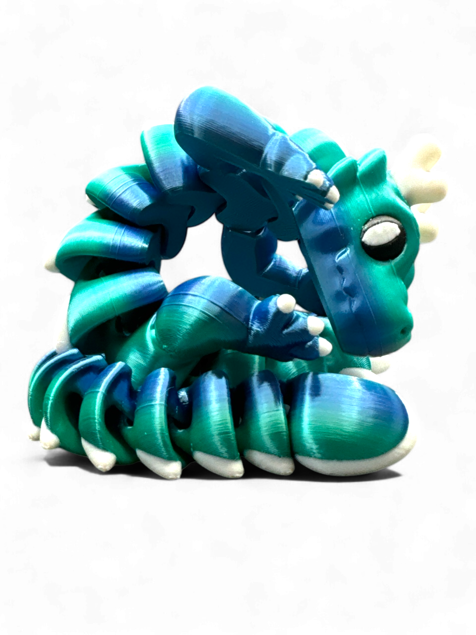 blue green cute dragon as 3d-printed collectible fidget toy by Zou3D and 3D Marvels